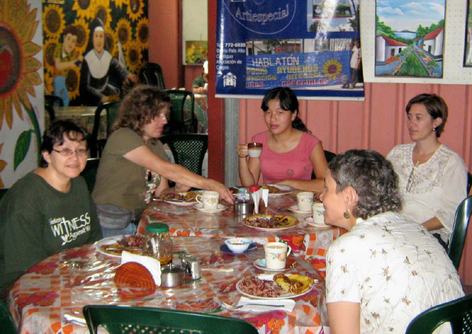 Sister Rebecca, Sandy, Jessie, Marjory and Lisa enjoy a breakfast of gallo pinto at the cafe run by Familias Especiales.
